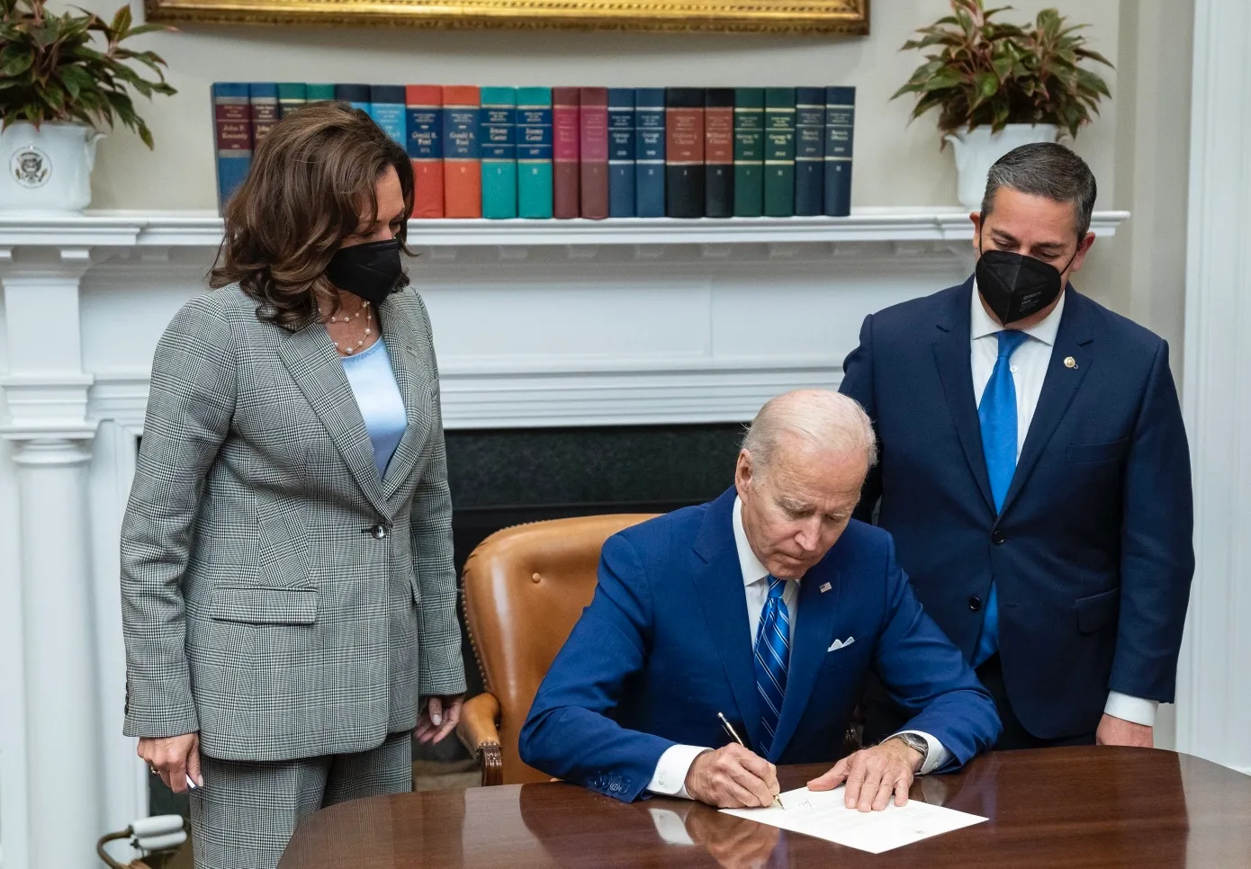 The U.S. President signing a major disaster declaration document at a desk