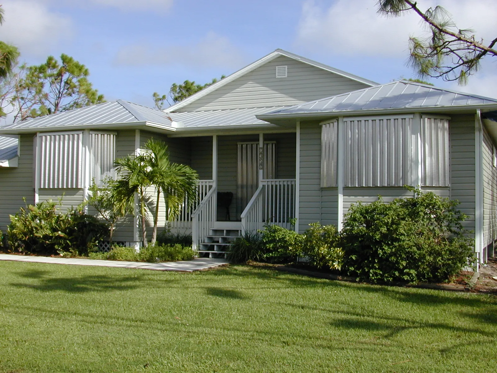 A home protected by metal hurricane shutters in the Hurricane Charley impact zone