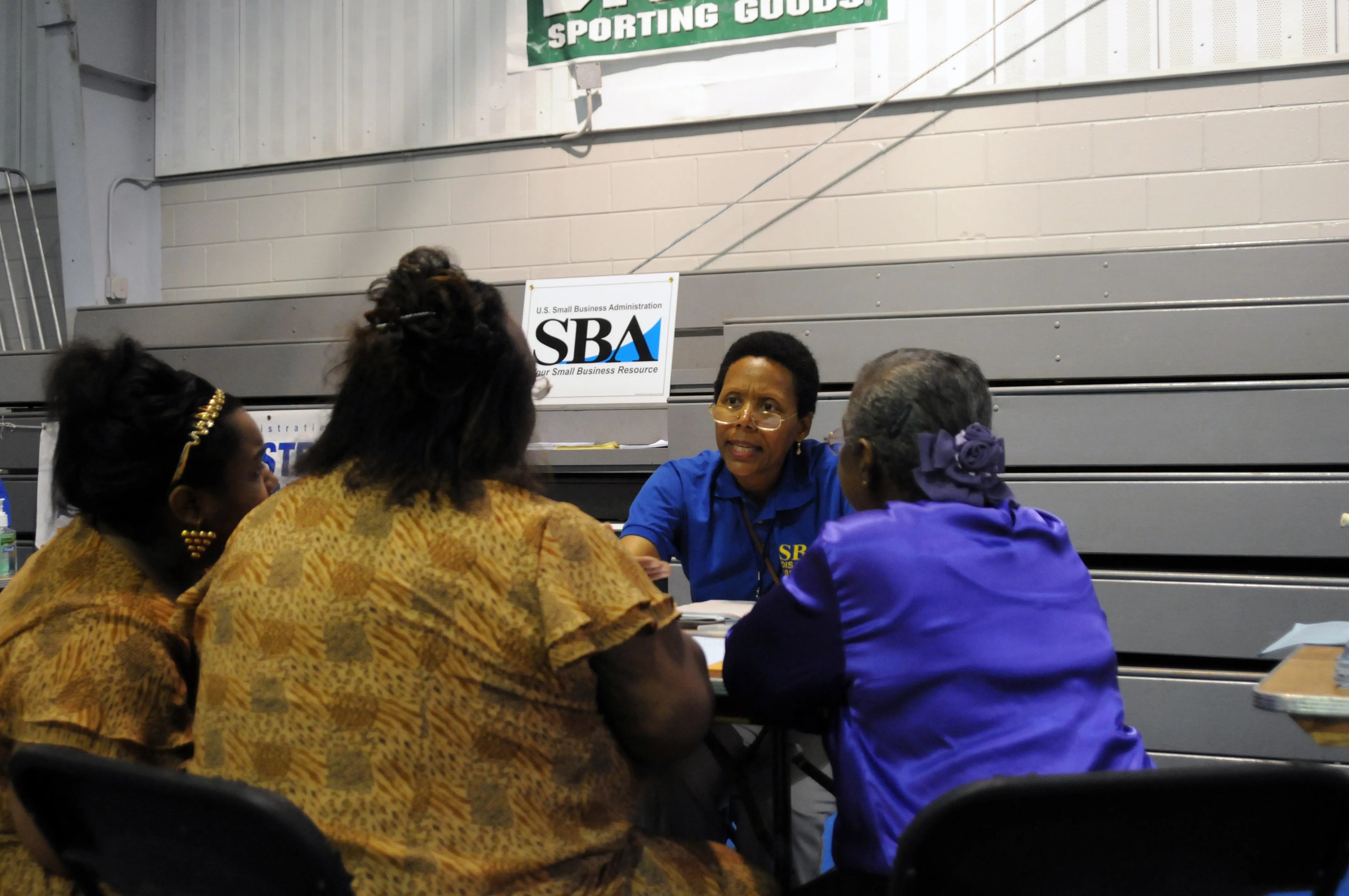 A representative meets one-on-one with survivors at a disaster recovery center to help start their paperwork