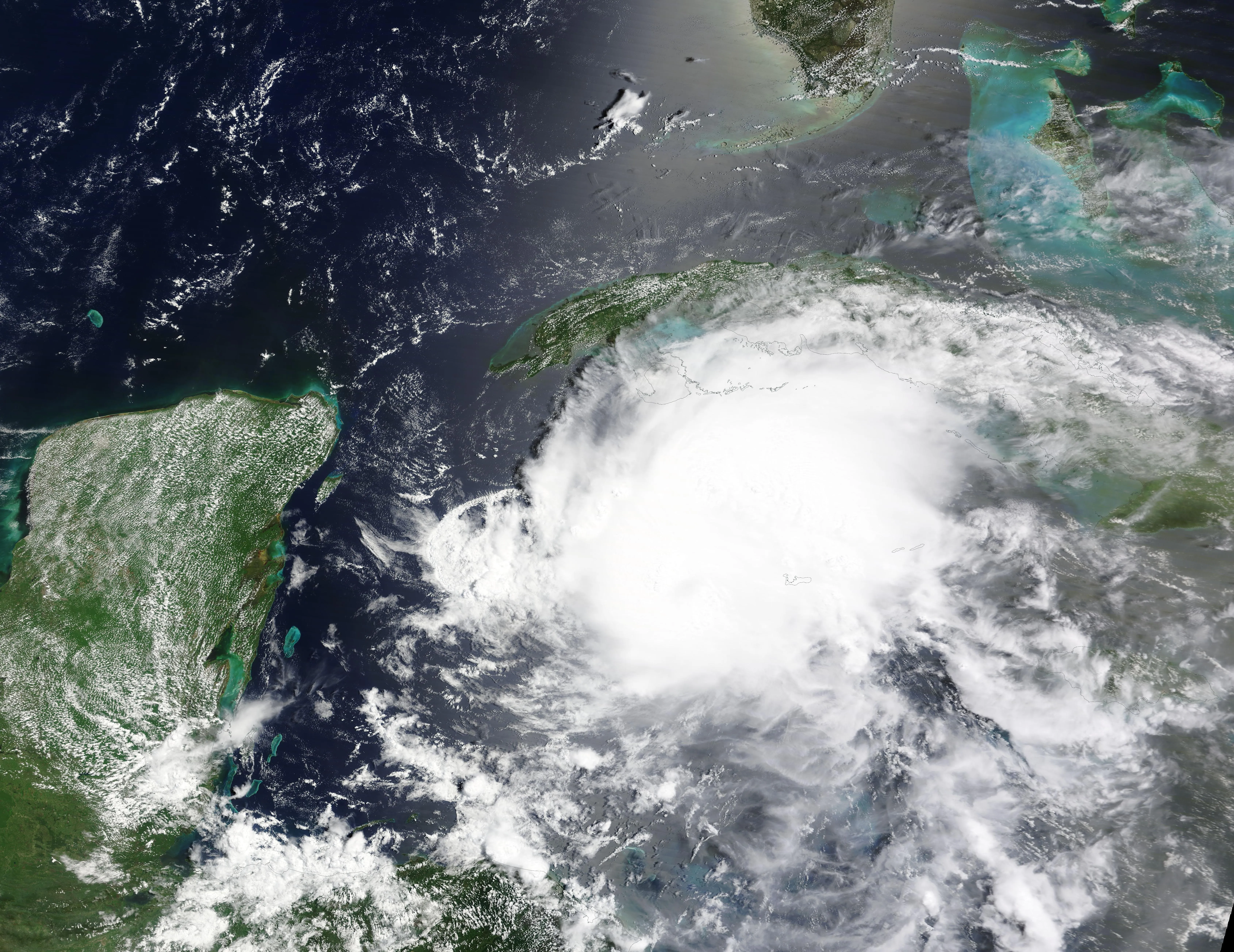 A compact, intense hurricane with a clear eye approaching the Yucatán Peninsula