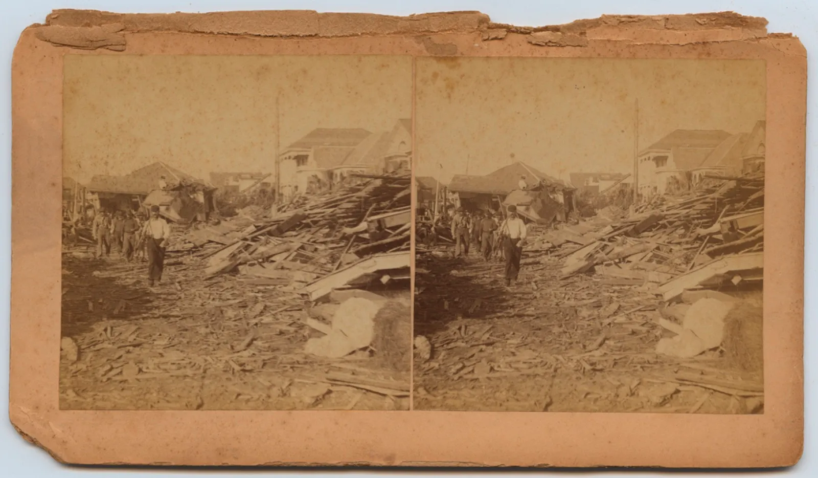 Survivors walking through the wreckage after the 1900 Galveston hurricane