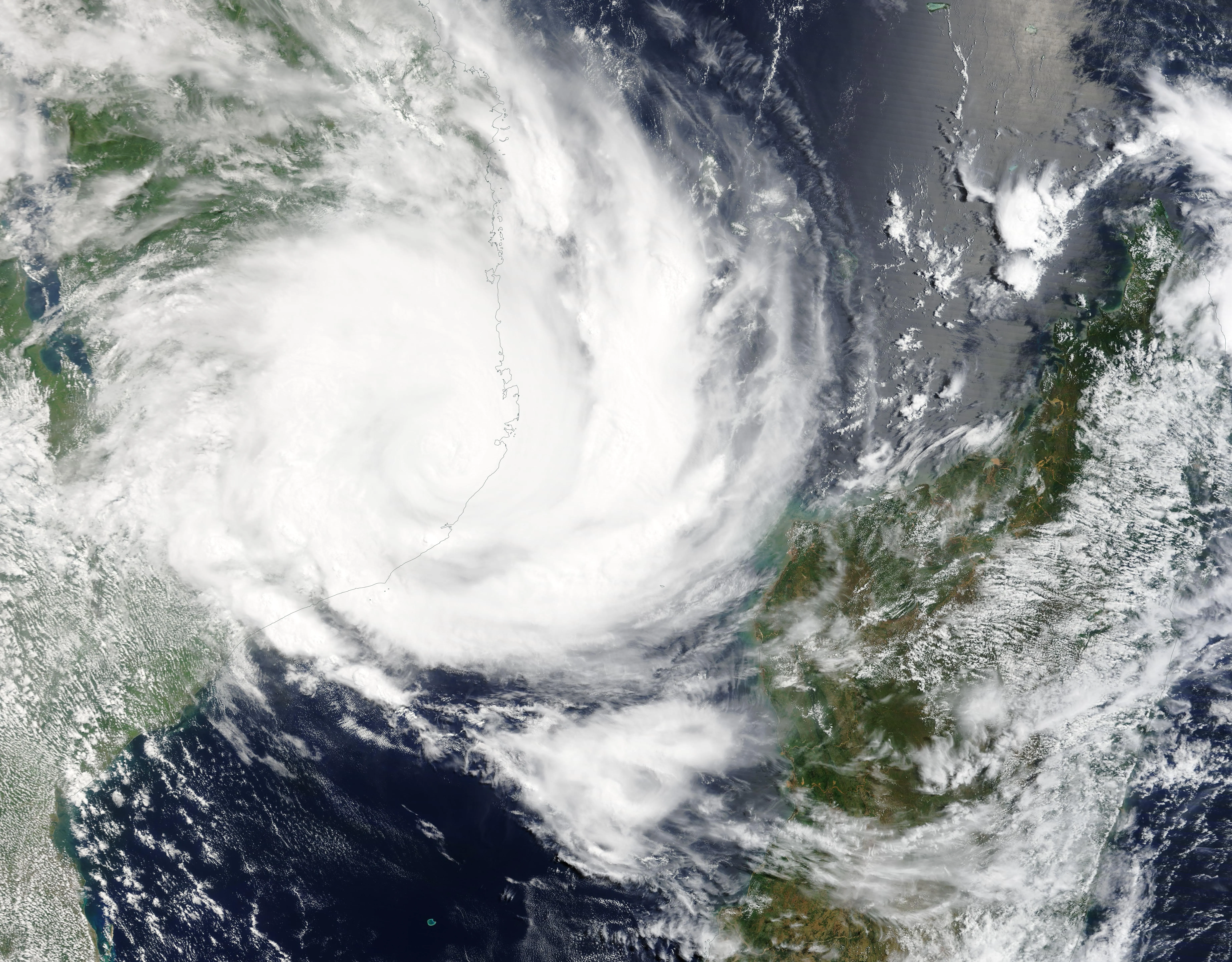A tropical cyclone whose center has moved over land, its cloud structure becoming ragged and disorganized