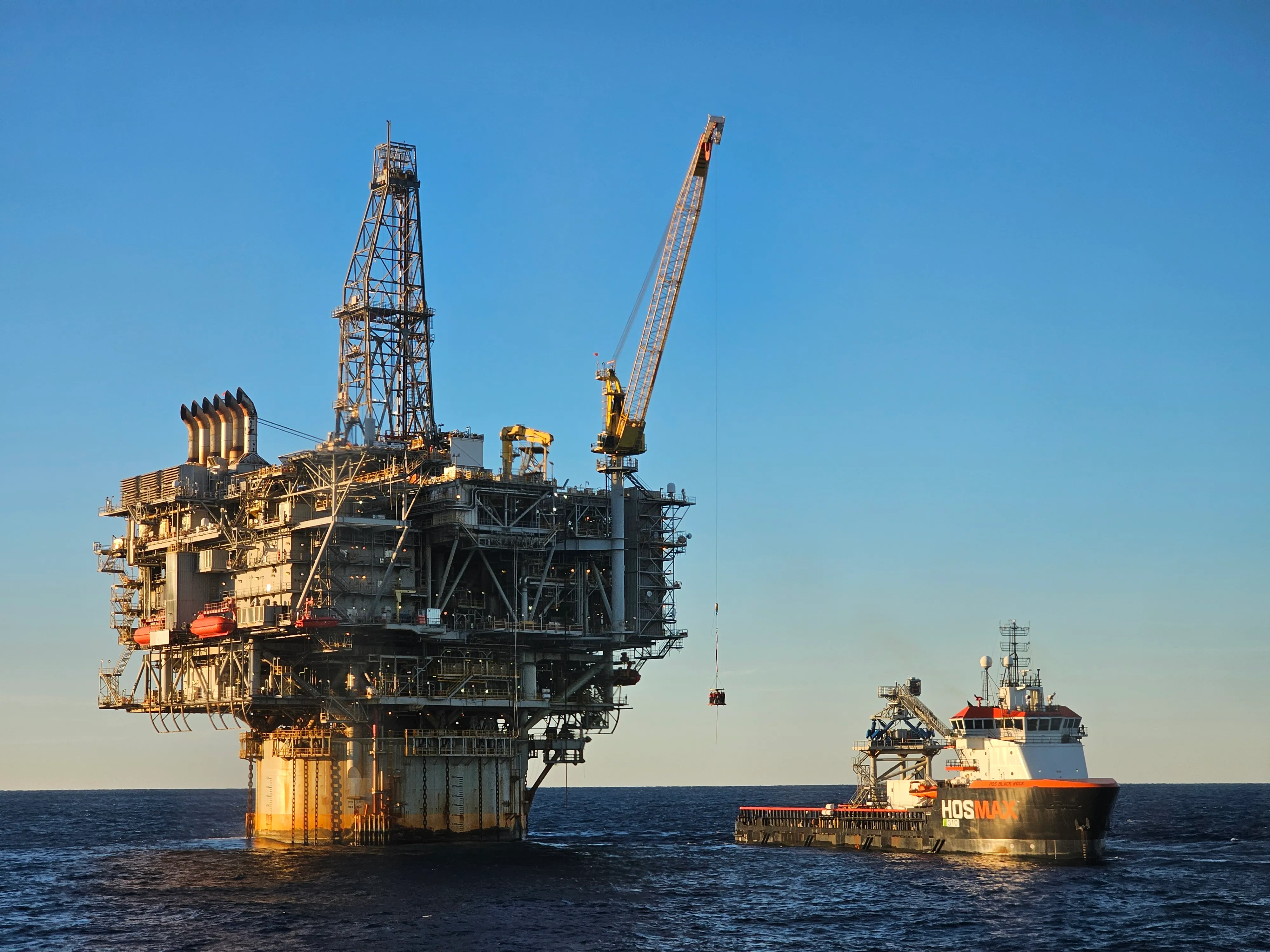 An offshore oil and gas platform standing in open ocean