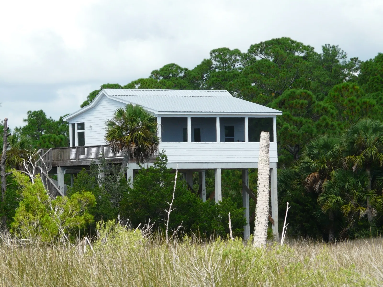 A coastal Florida home elevated on tall pilings above the flood zone