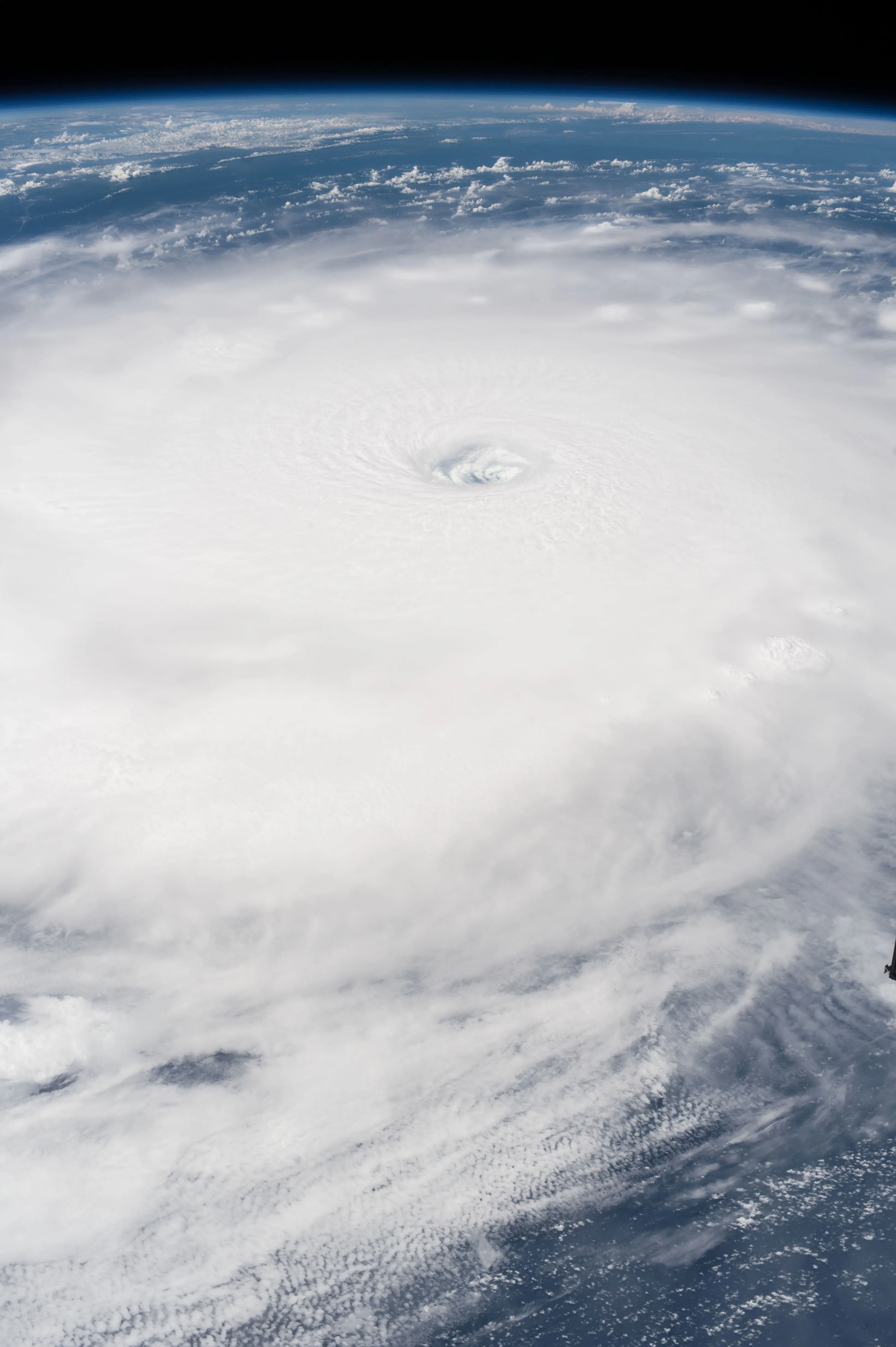 Hurricane Irma photographed from the International Space Station, showing a sharply defined circular eye ringed by the eyewall