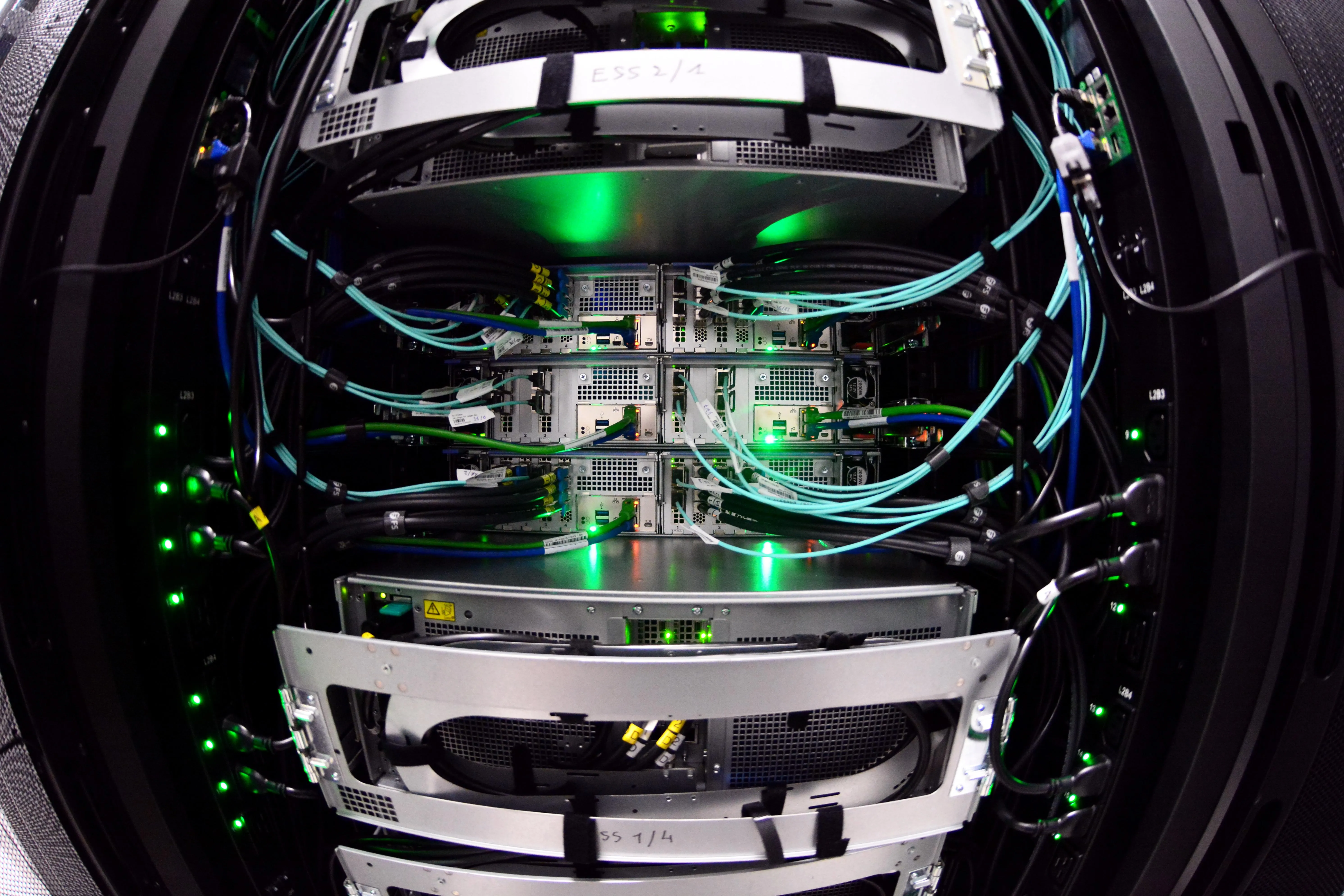 Densely cabled server racks inside a high-performance computing data center