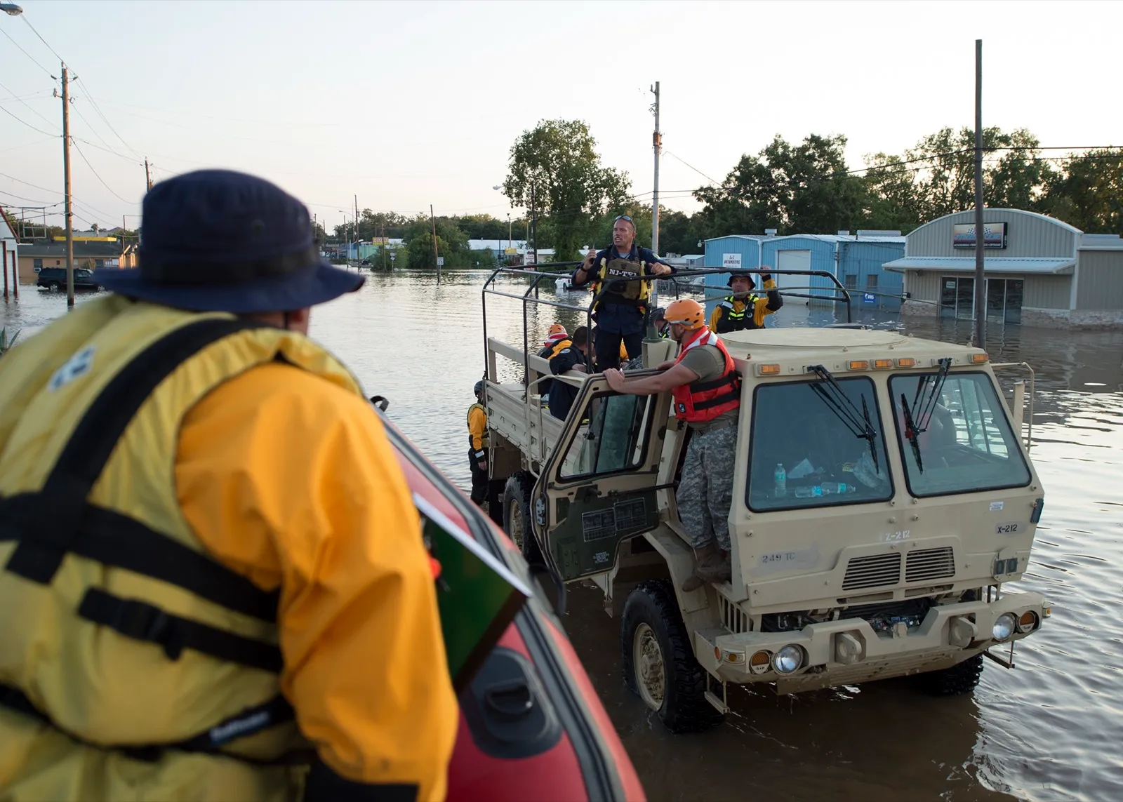 Texas National Guard troops conducting high-water rescues in flooded streets during Hurricane Harvey