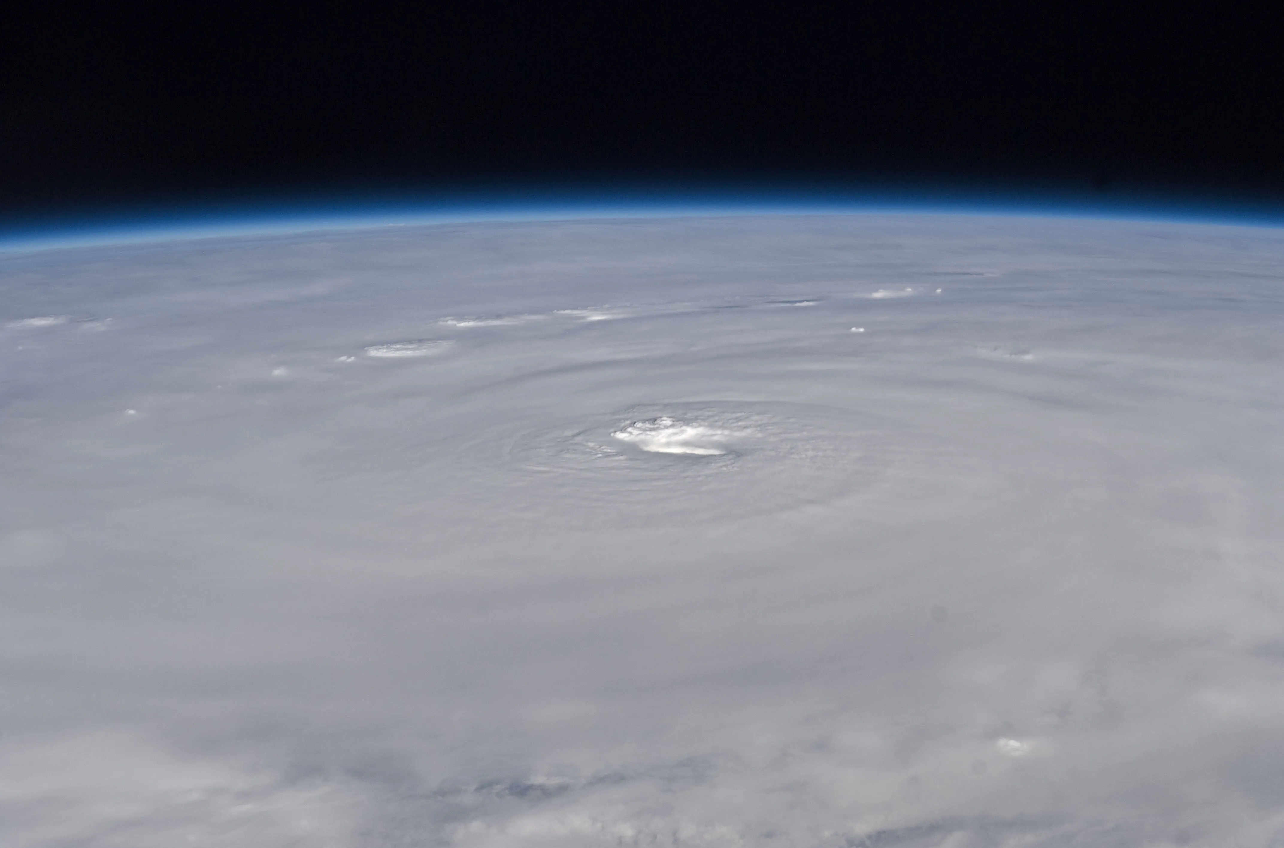 A powerful, well-organized hurricane viewed from space with a distinct eye and tightly wound spiral bands
