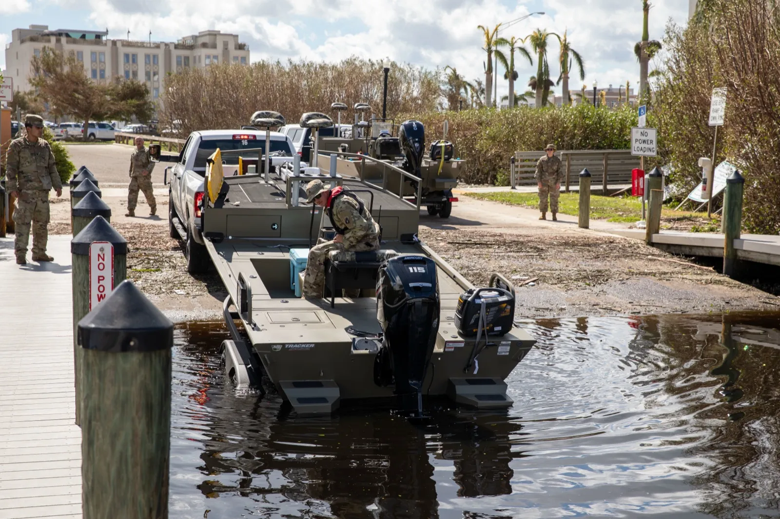 Florida National Guard soldiers launching a boat for search and rescue after Hurricane Ian