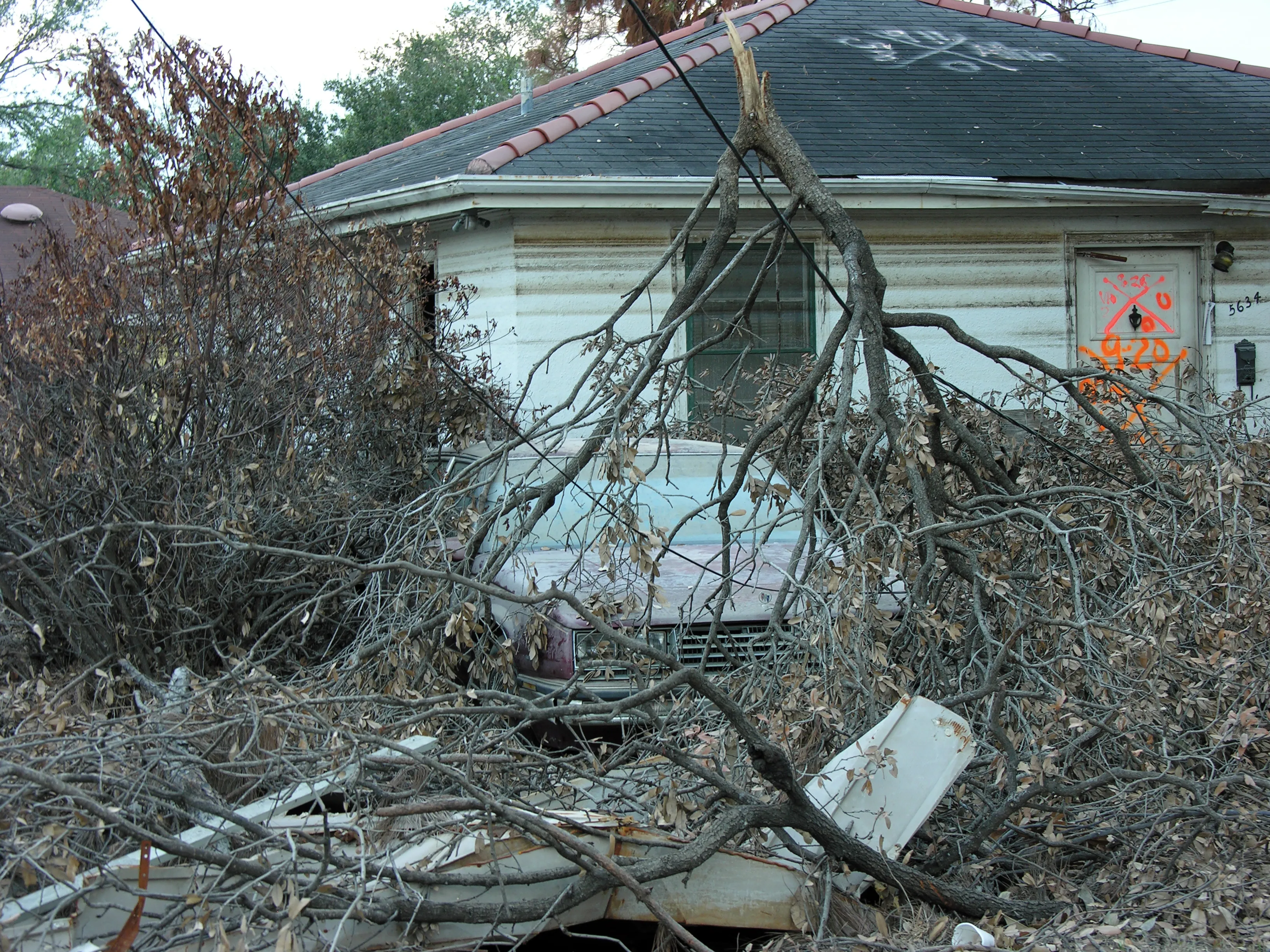 A home submerged to its roofline by Hurricane Katrina floodwaters in New Orleans