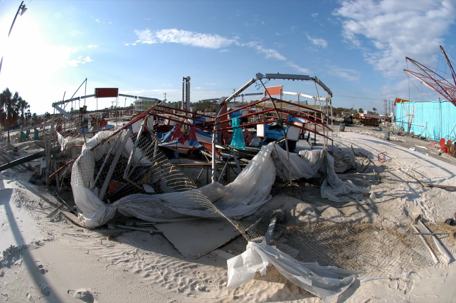 Beachfront structures buried in surge-driven sand and debris on the Alabama coast after Hurricane Ivan