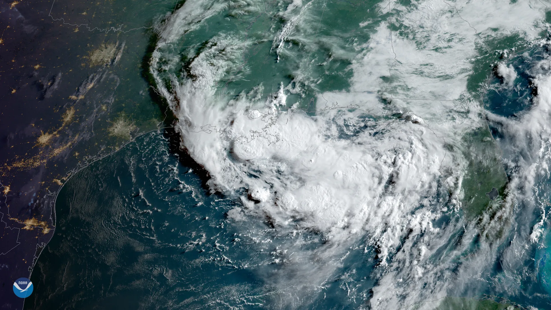 Tall thunderstorm clouds bubbling up over warm ocean water, seen from a weather satellite