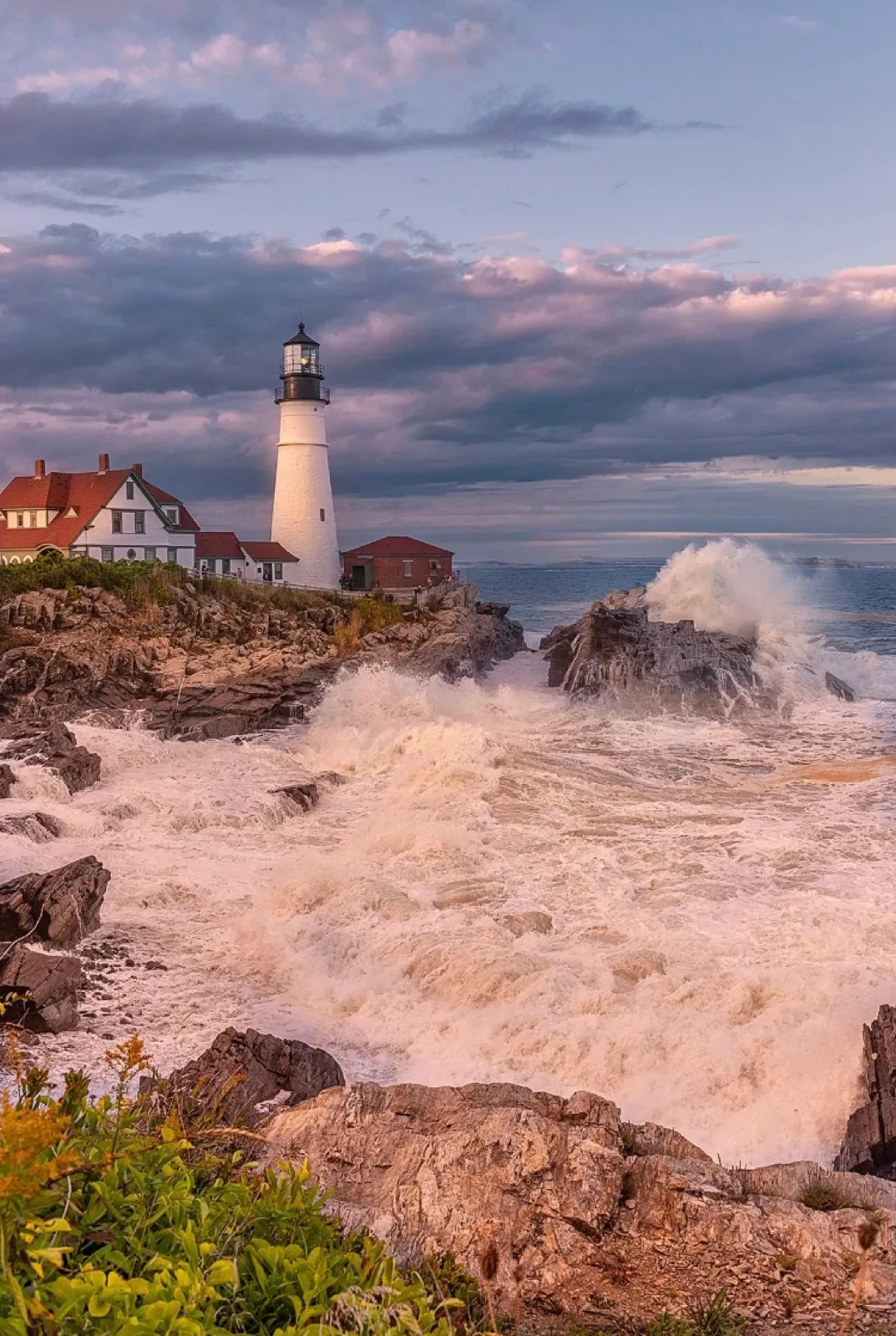 Large waves driven by storm surge crashing against the coast