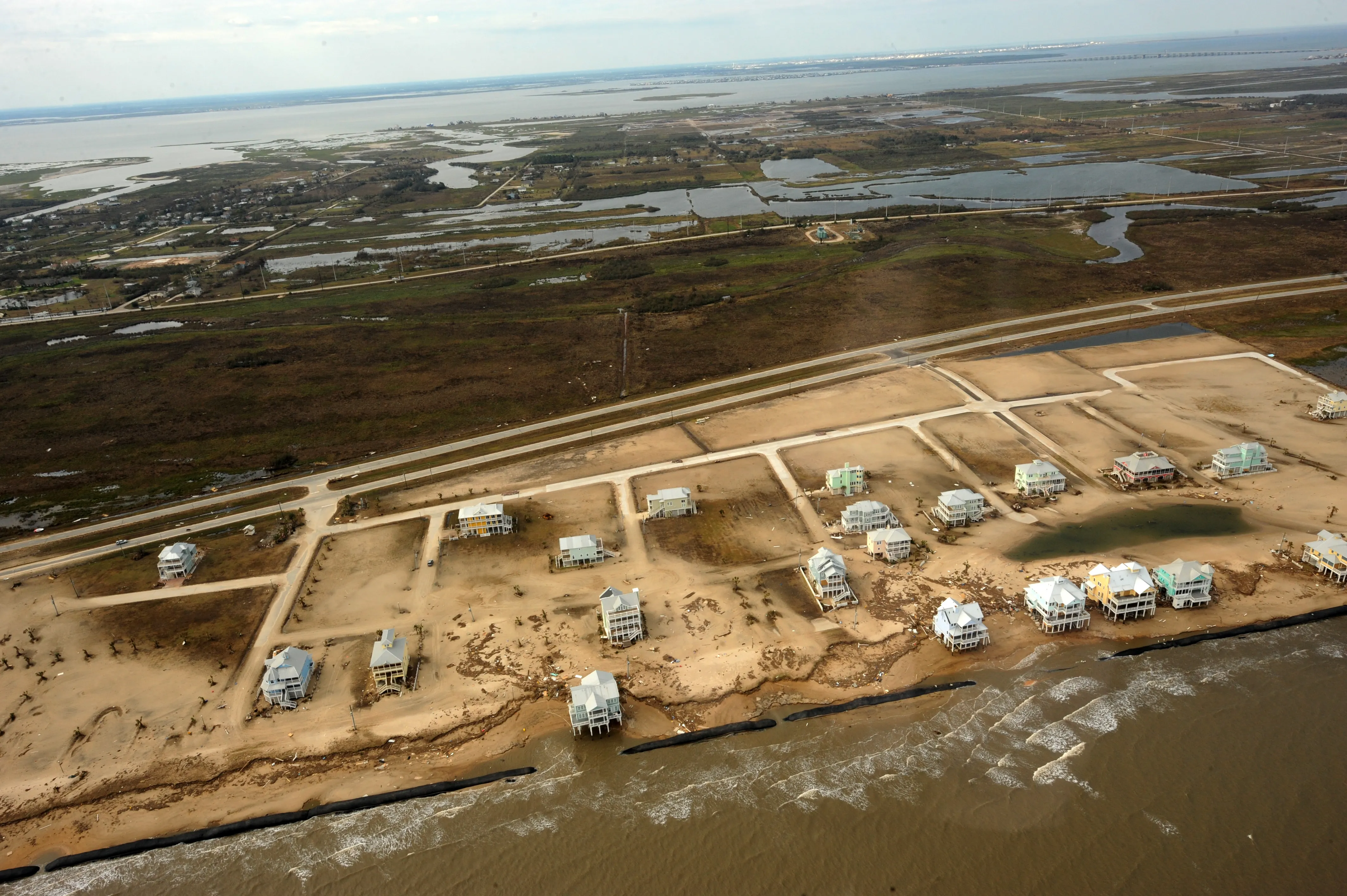 An aerial view of the Bolivar Peninsula after Hurricane Ike, with only a handful of homes left amid empty lots