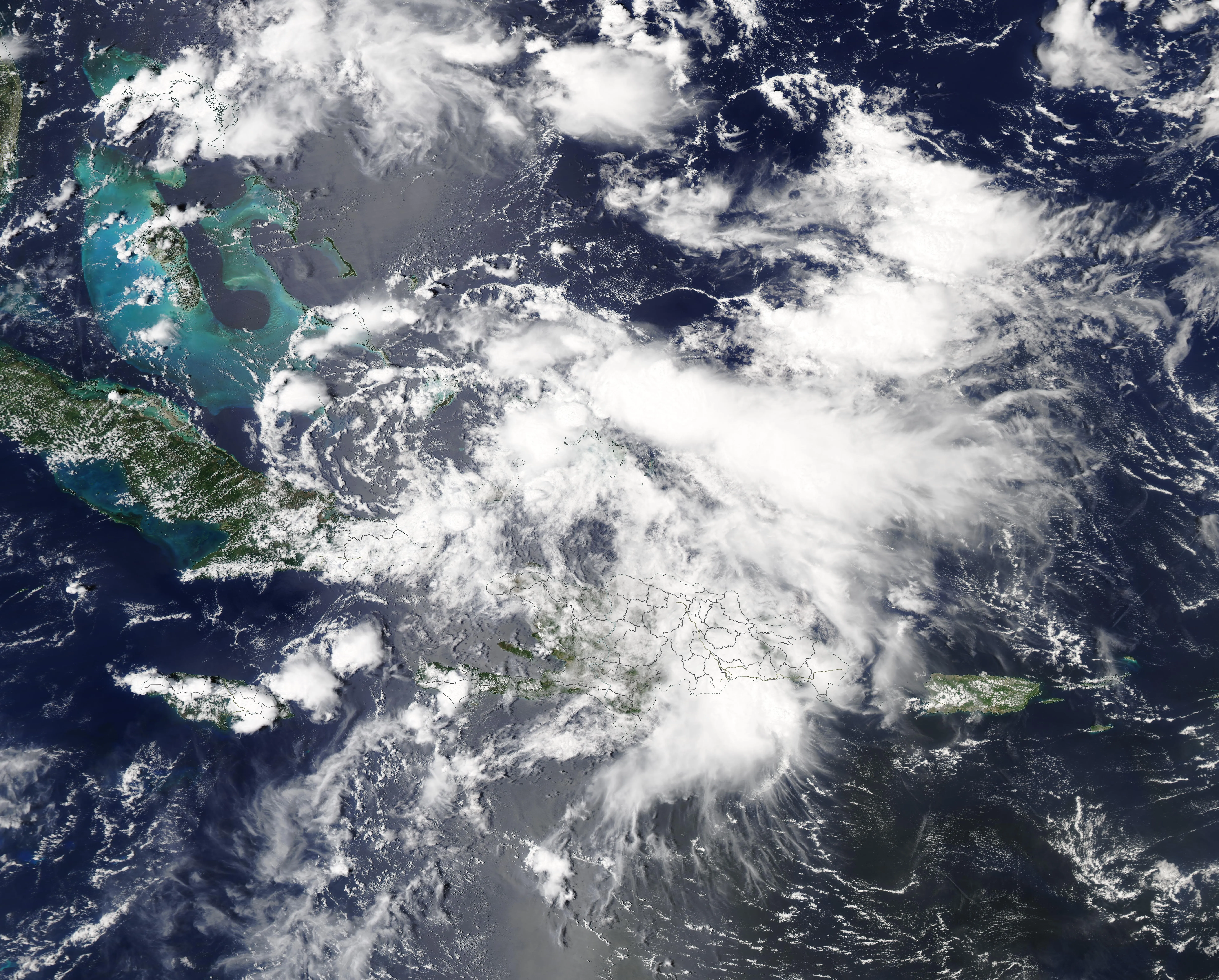 A disorganized tropical depression with scattered thunderstorms over the Caribbean Sea
