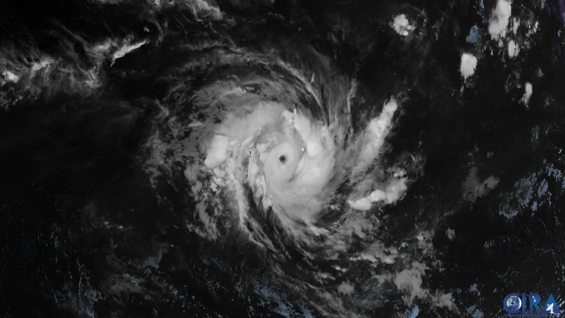 A tropical cyclone with a sharply defined eye spinning clockwise over the southern Indian Ocean