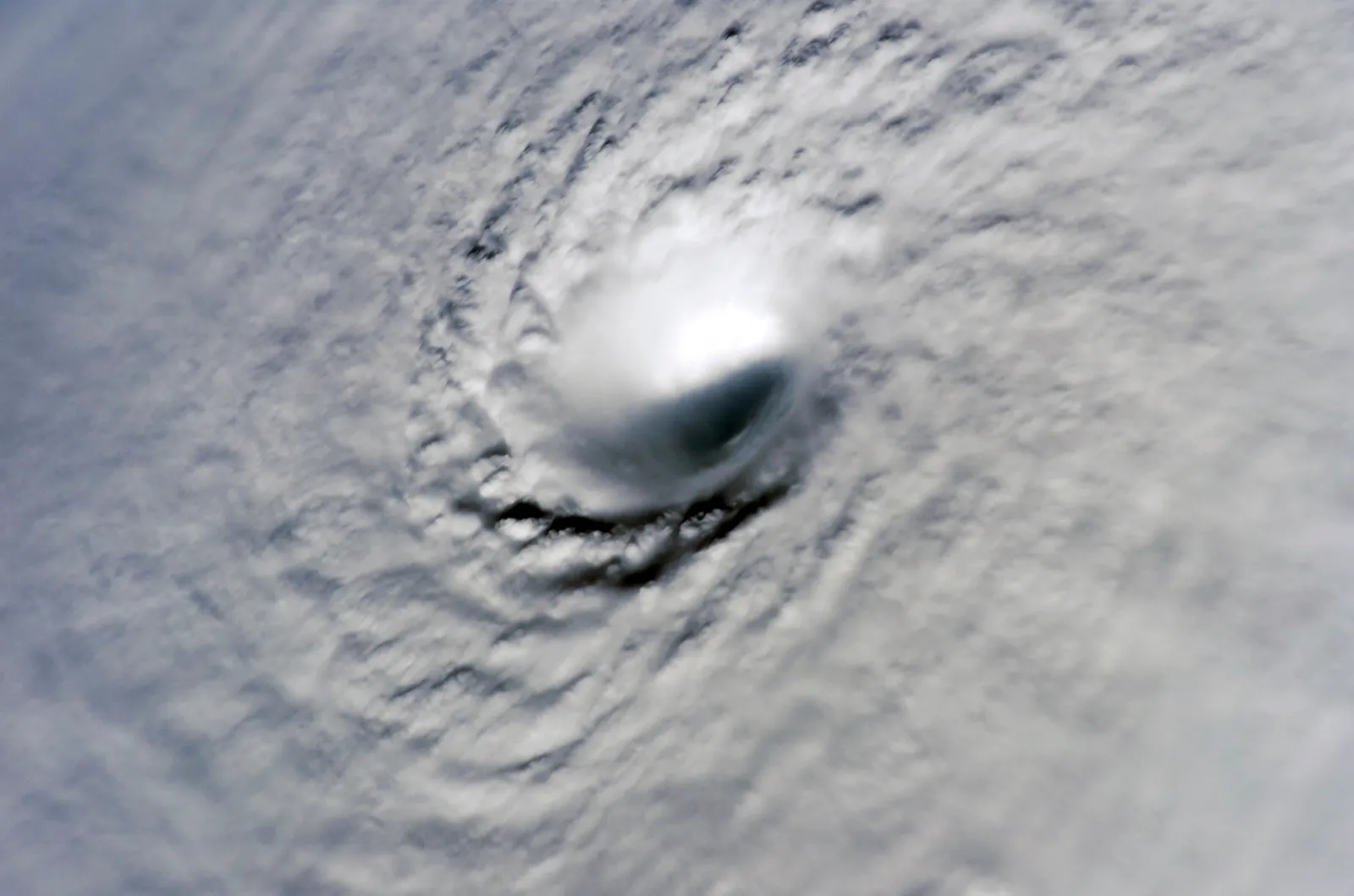 View looking down into the tiny eye of Hurricane Wilma from the International Space Station
