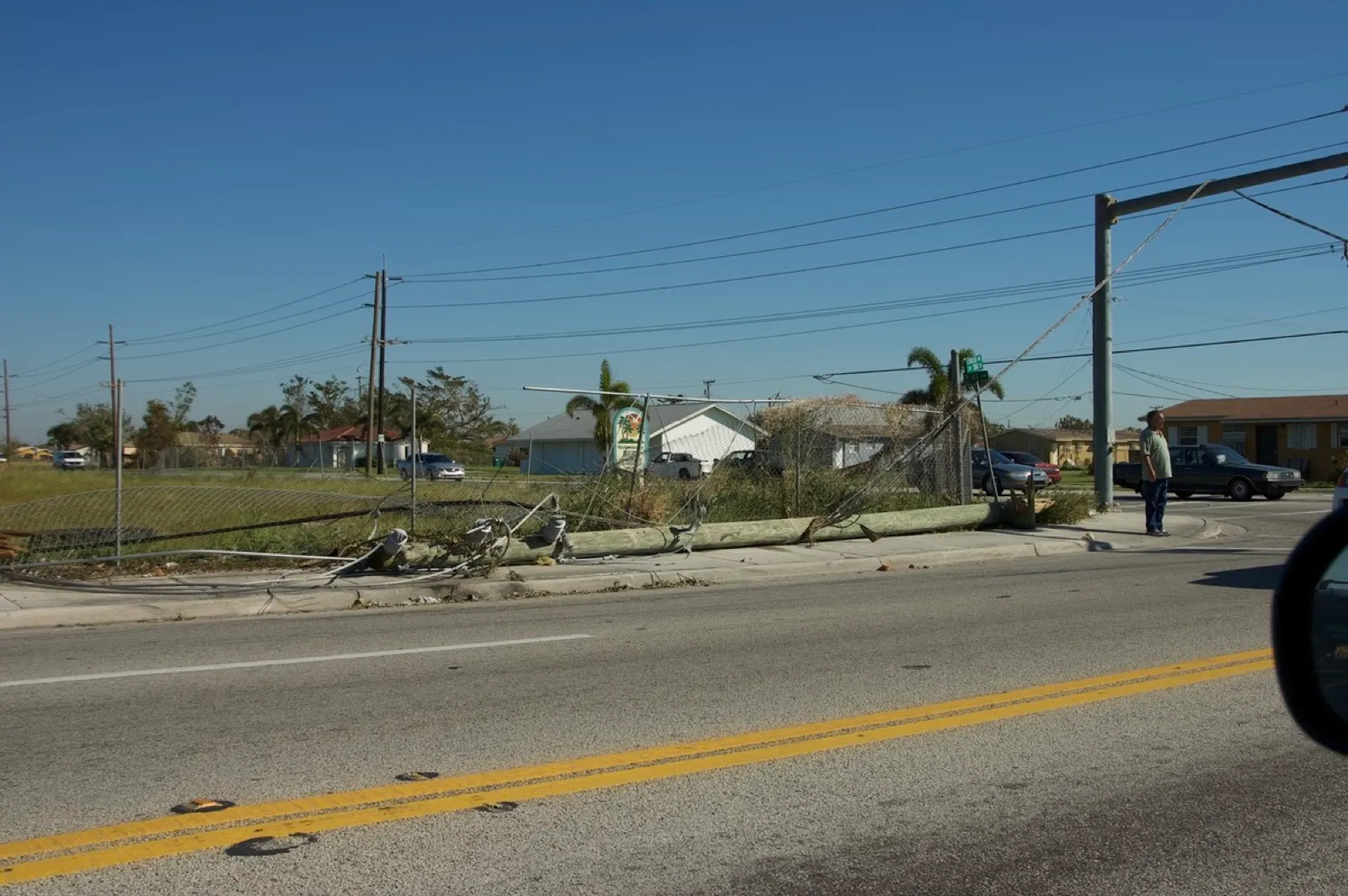 Downed power lines along a suburban road in the Miami area after Hurricane Wilma